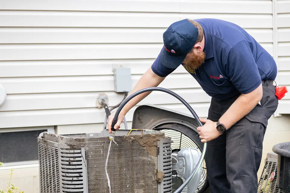Jennings tech cleaning dirty AC unit