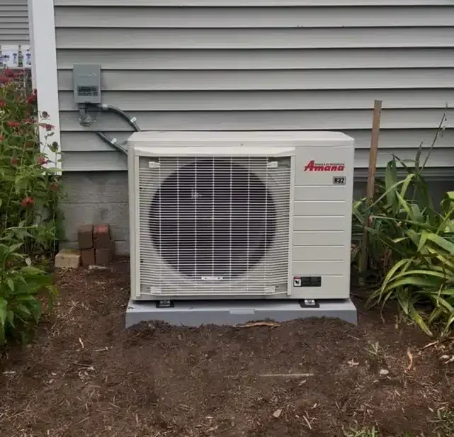 Heat pump outside of residential home in Akron.