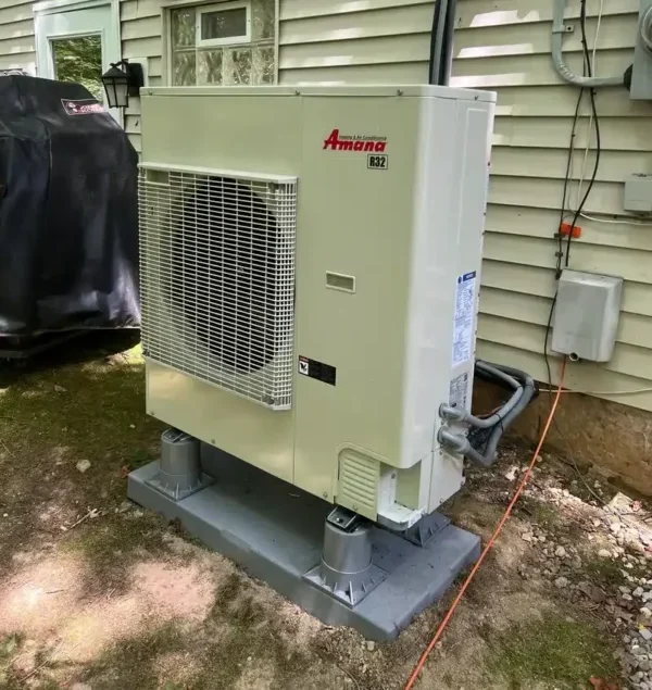 Heat pump outside of residential home in Akron.