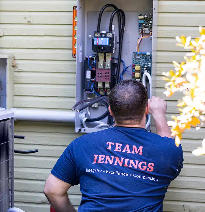 Jennings electrician working on a panel