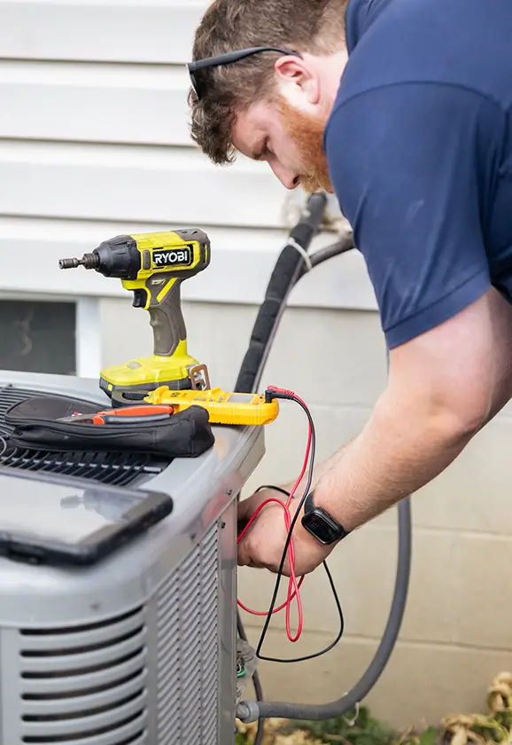 Jennings tech repairing AC unit