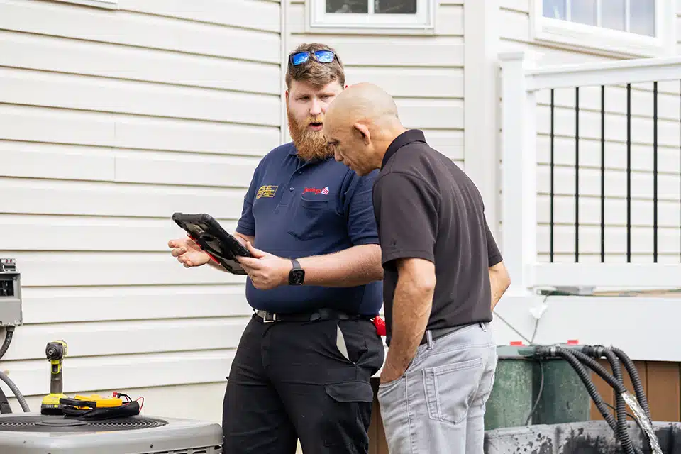 Jennings tech talking with homeowner